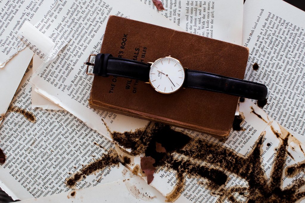 a wristwatch on a book